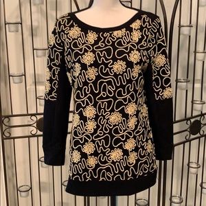 Pullover top with gold embellishments